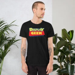 2021 Doll Tale Display Geek - Short-Sleeve Unisex T-Shirt -Displaygeek Shop unisex staple t shirt black heather front 6187414e76749